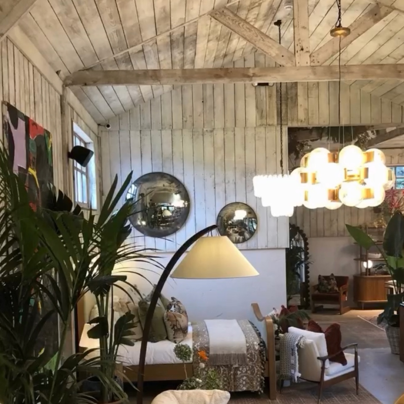 Convex mirrors and lighting in a barn interior